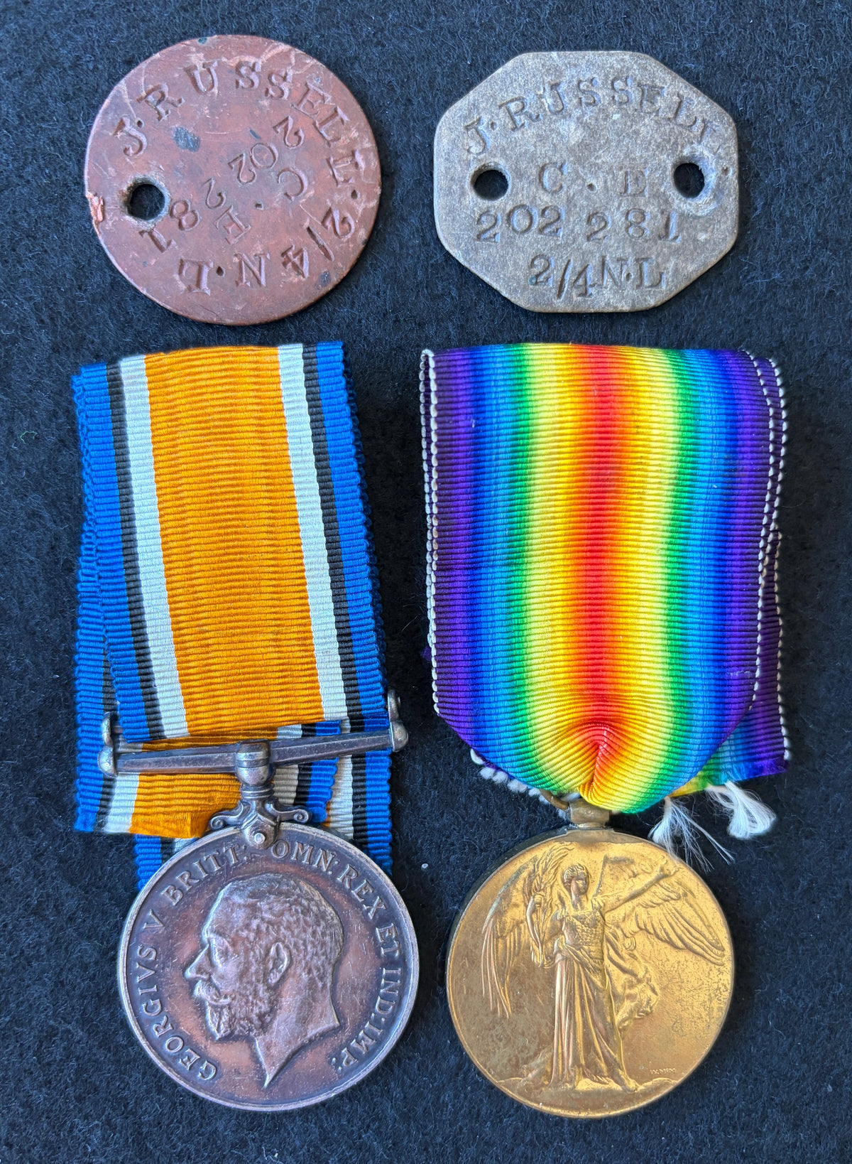 WW1 medal pair & ID discs (Dog Tags) – British War Medal & Victory Medal – Awarded to JAMES RUSSELL of the Loyal North Lancashire Regiment, along with 2 x identification discs (Dog Tags) in the name J RUSSELL